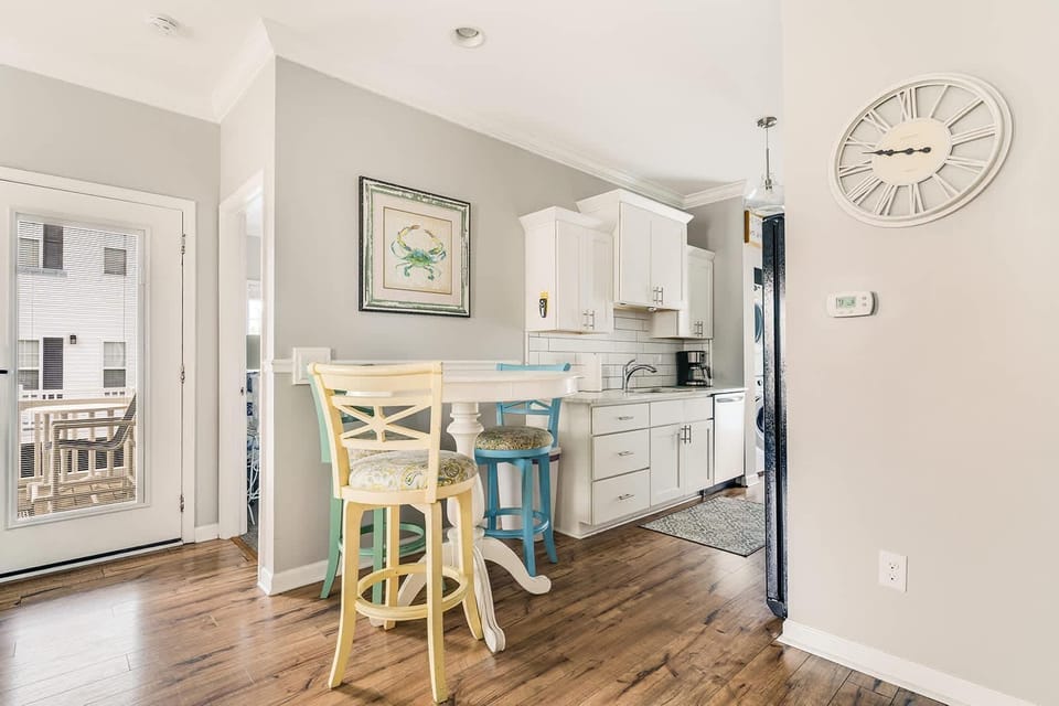 Bright, airy kitchen with cozy breakfast bar seating