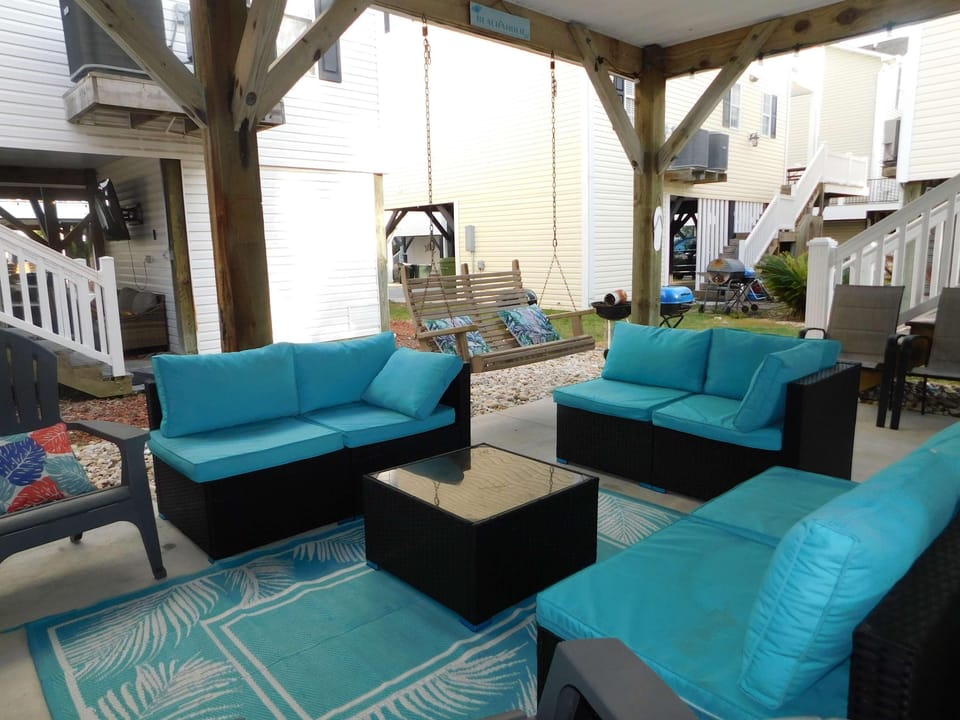 Cozy covered patio with vibrant seating for relaxing gatherings