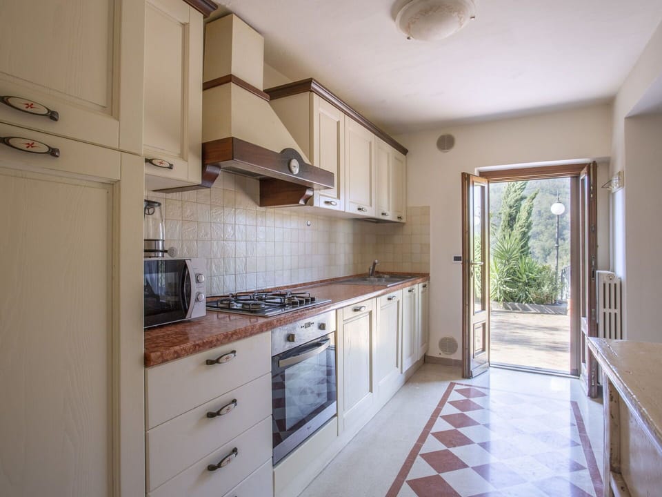 Countertop, Cabinetry, Property, Furniture, Kitchen, Kitchen Appliance, Kitchen Stove, Building, Wood, Drawer