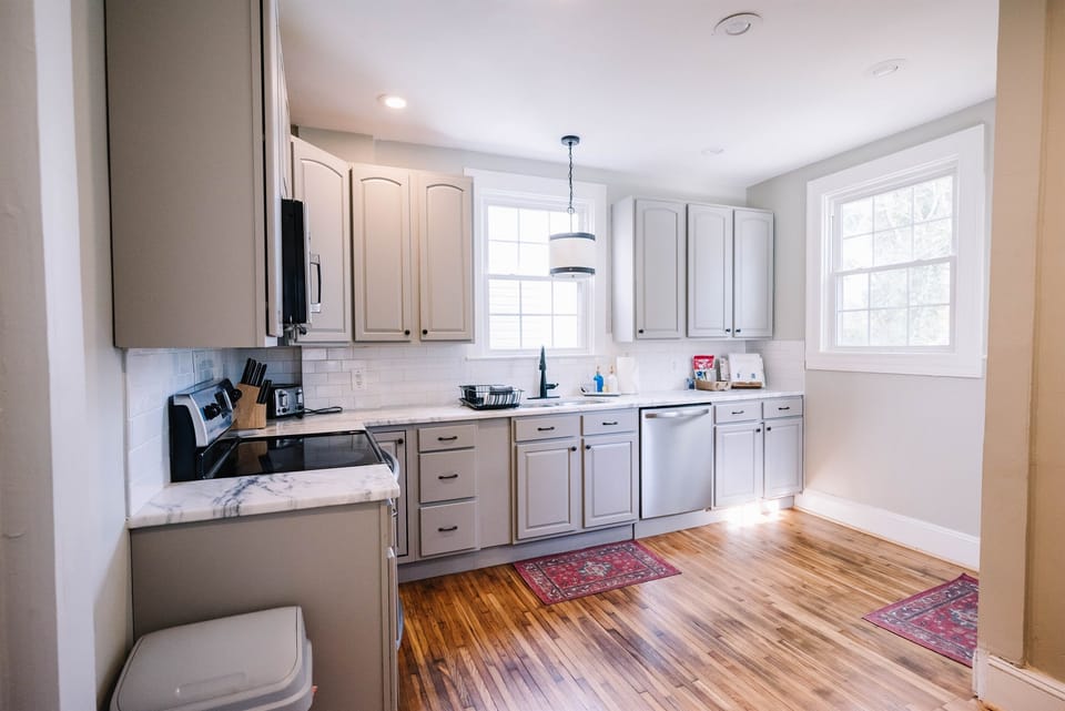 This bright and beautiful kitchen is fully equipped with everything you need to enjoy a home cooked meal. 