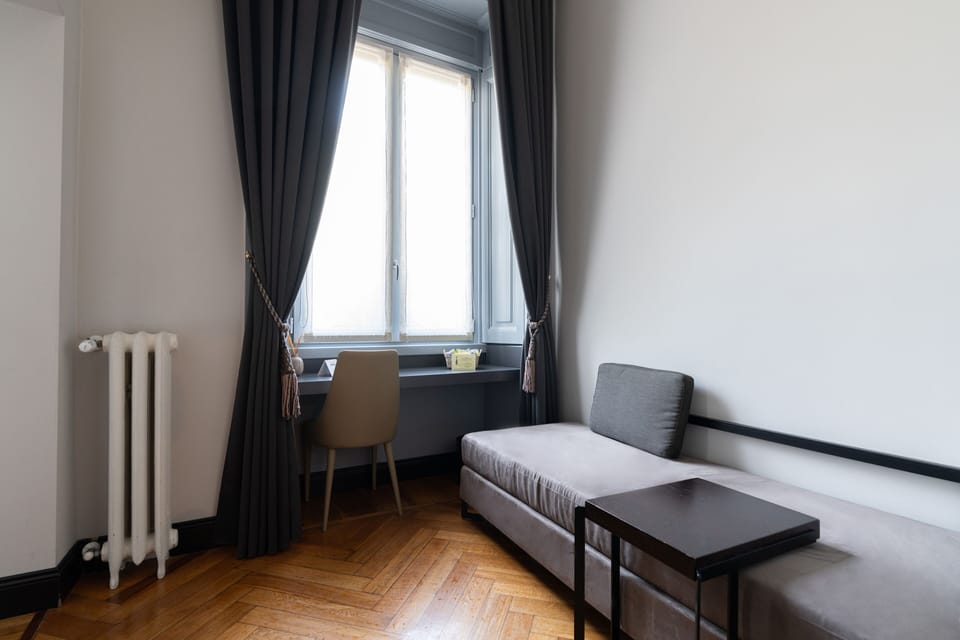 Luxury Suite | Living area | 40-inch flat-screen TV with digital channels, TV