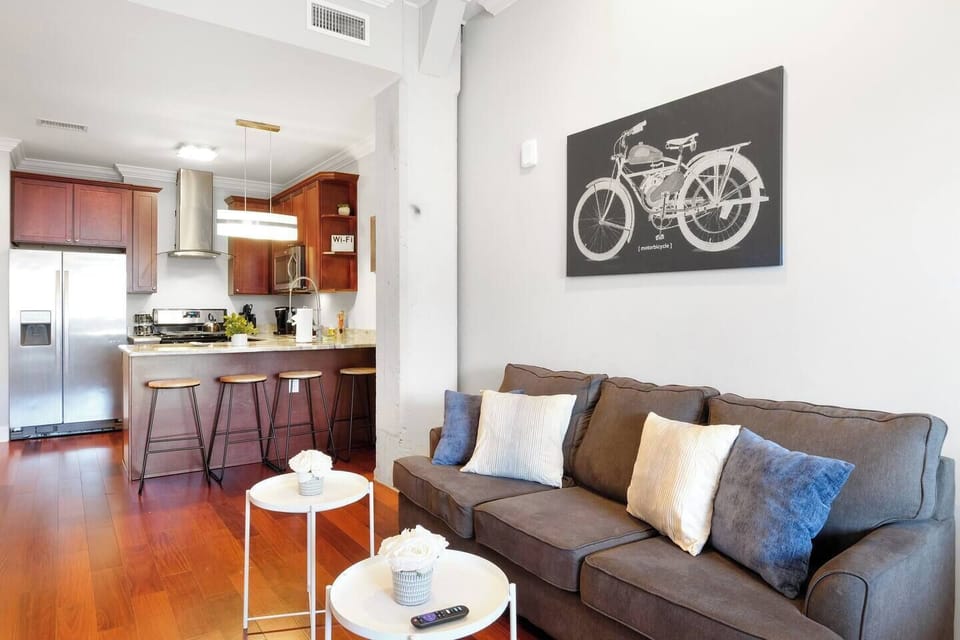 Dining nook with designer table, chairs, and curated artwork creating inviting atmosphere.