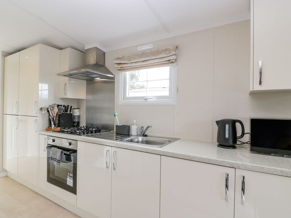 Fridge, electric kettle, toaster, cookware/dishes/utensils