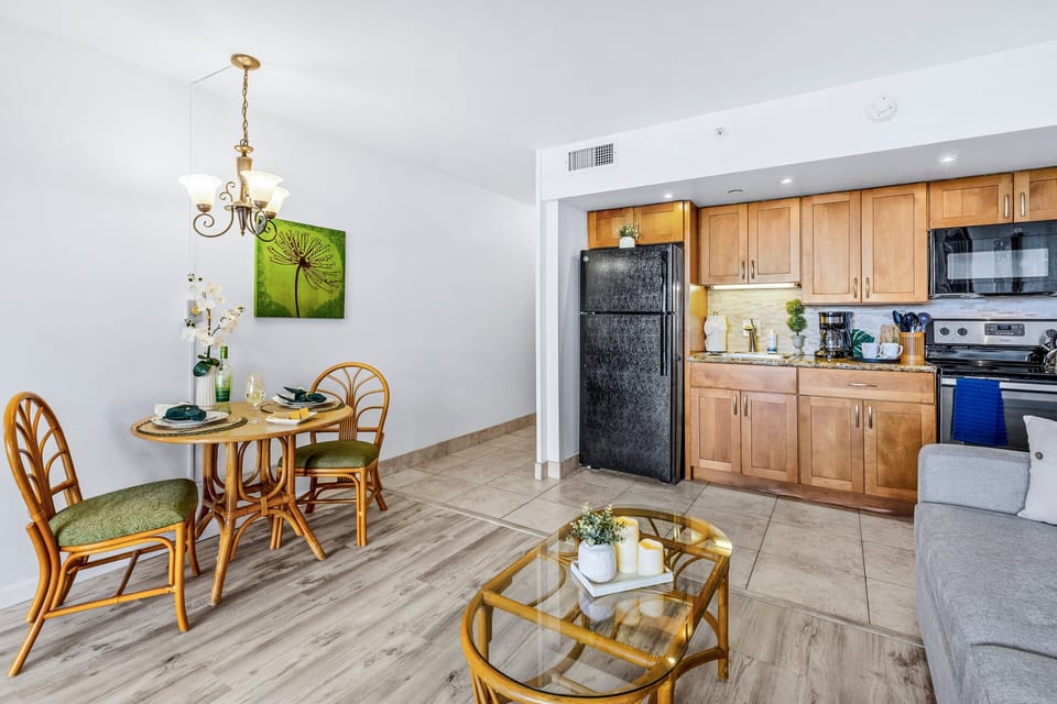 Dining area and fully equipped kitchen for convenient meals at home.
