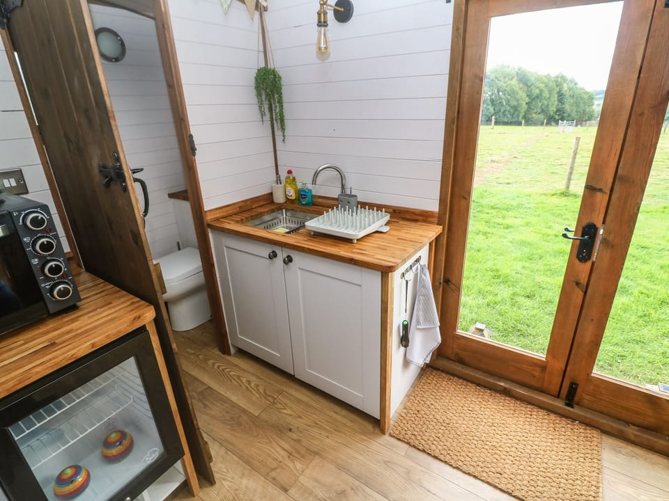 Fridge, electric kettle, toaster, cookware/dishes/utensils