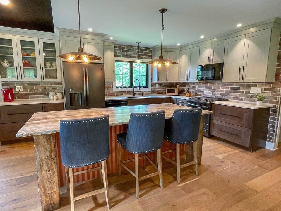 Chef’s kitchen with barstool seating (open floor plan with dining & living areas)