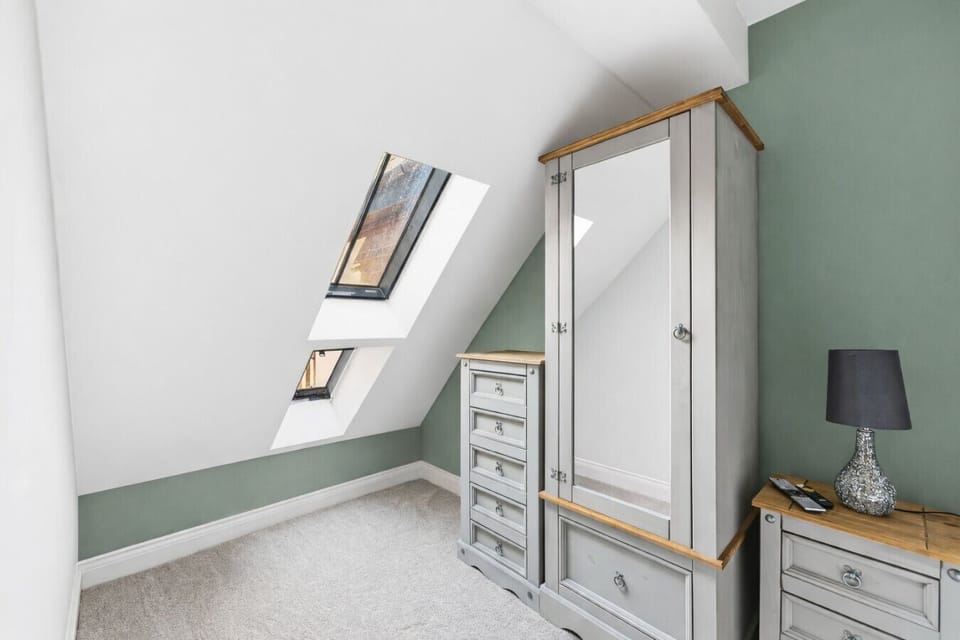 Bedroom 4 has a comfortable king-size bed with fresh linen and towels provided.