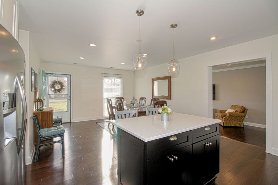 The dining room table easily seats 6. We can provide an extra leaf, booster seat, and a highchair.