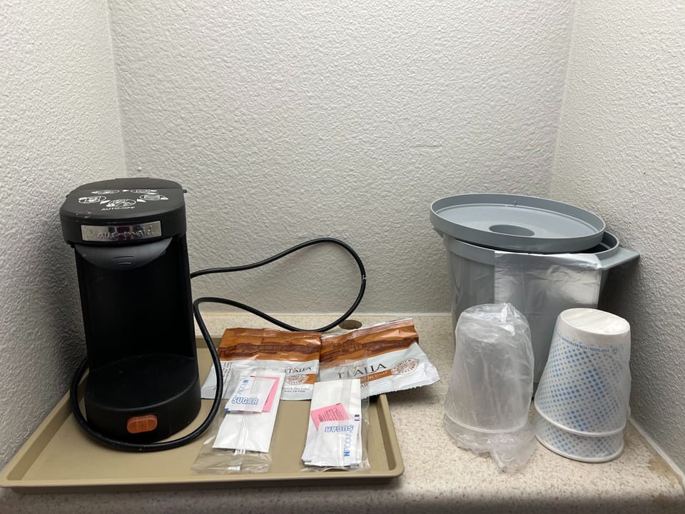 Desk, laptop workspace, blackout drapes, rollaway beds