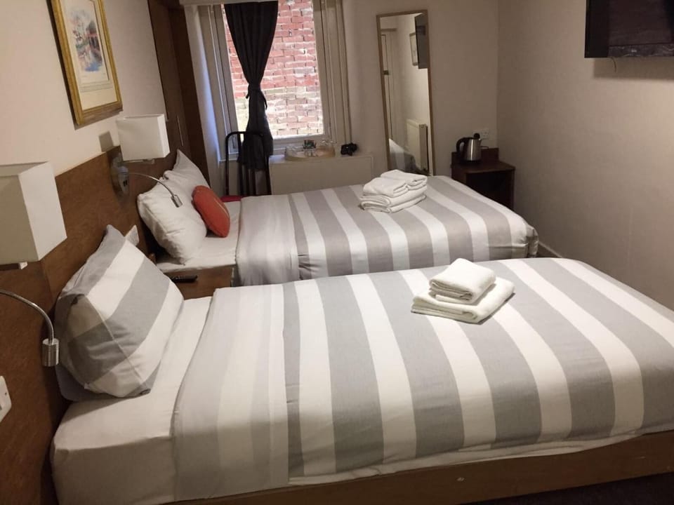 Blackout drapes, iron/ironing board, free WiFi, bed sheets