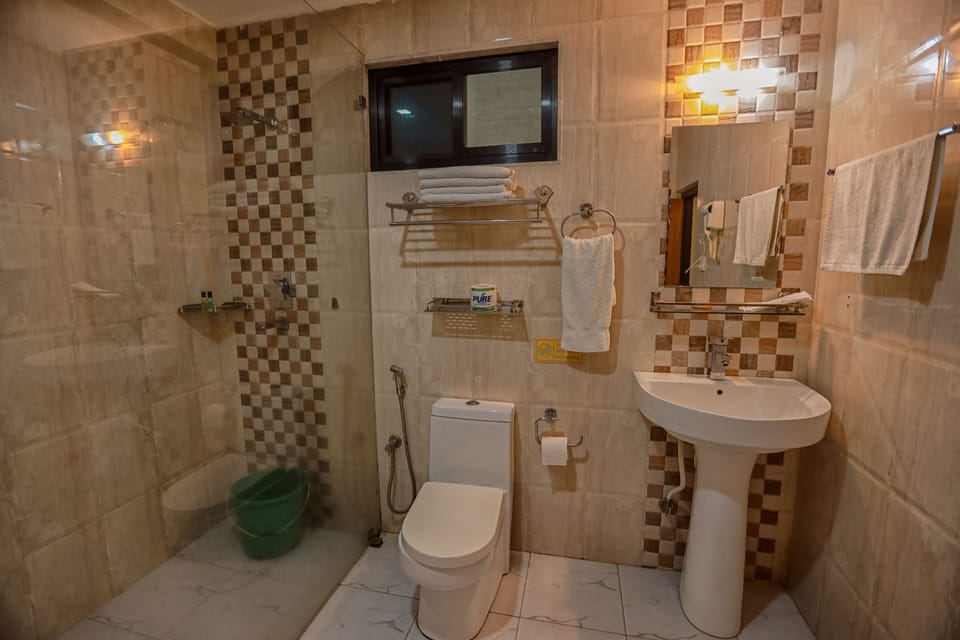 Shower, designer toiletries, hair dryer, bathrobes