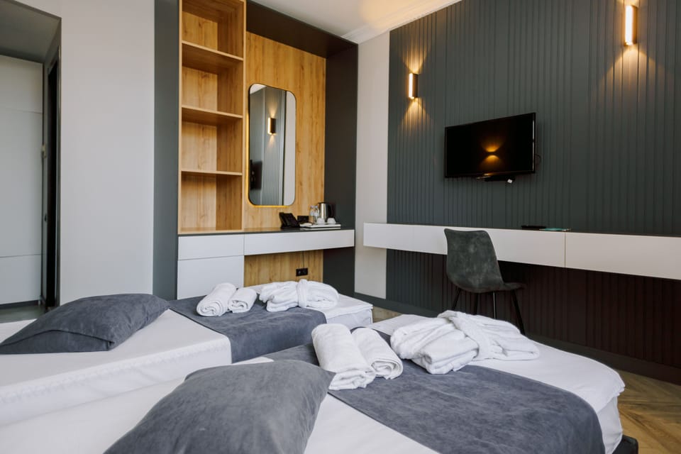 Standard Twin Room, Multiple Beds, Non Smoking, Balcony | Minibar, in-room safe, desk, iron/ironing board
