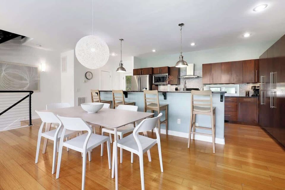 Between the kitchen and living room, you'll find our large dining room table with seating for 6.