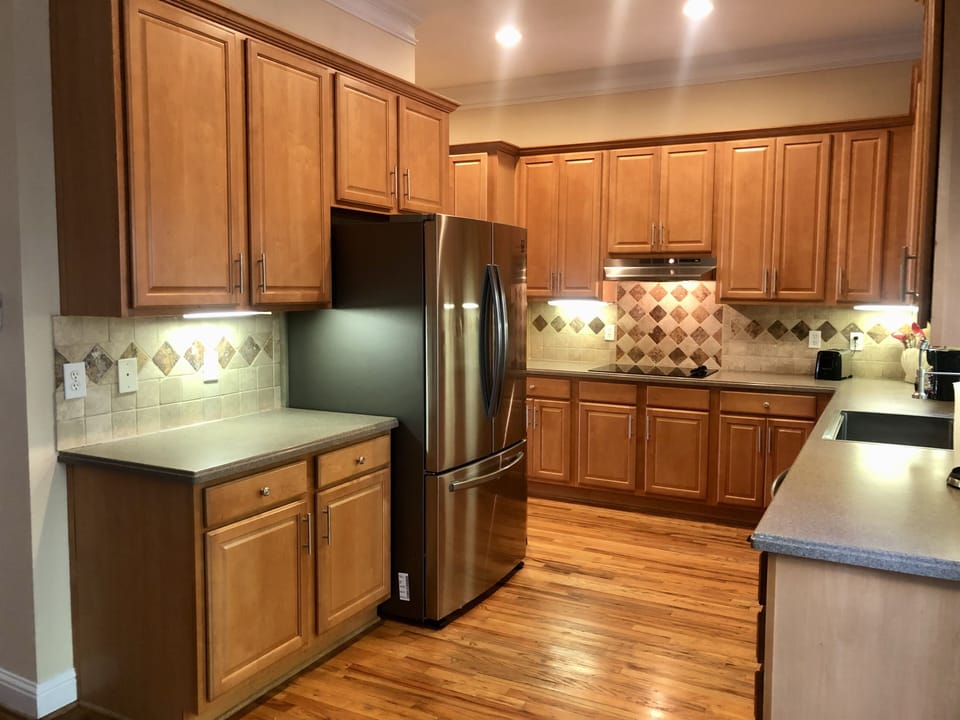 Kitchen with double door  refrigerator and ice-maker 