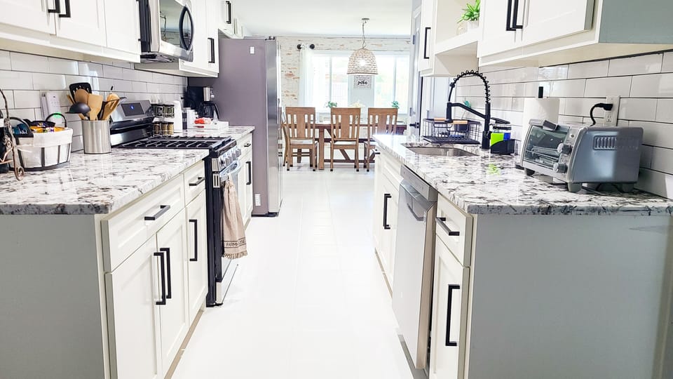 Galley kitchen. Fully stocked with pots and utensils.