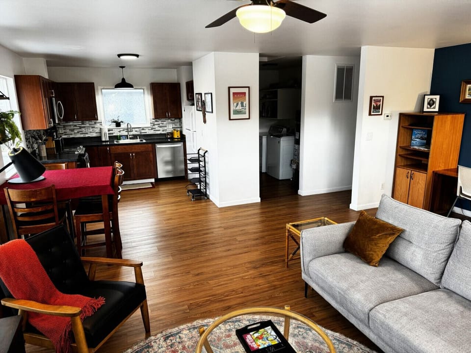Open living room, dining, and kitchen