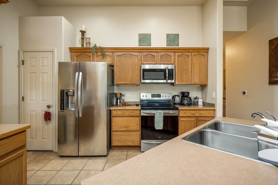 Fully stocked kitchen with stainless steel appliances for all your dine-in needs