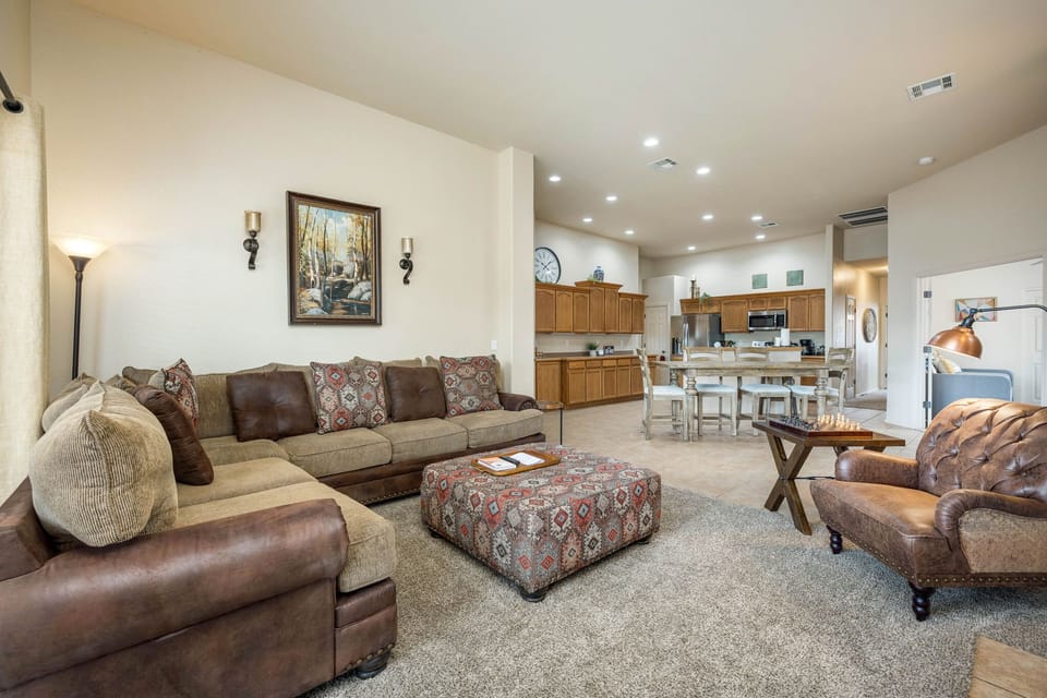 Open living / dining / kitchen with high ceilings throughout