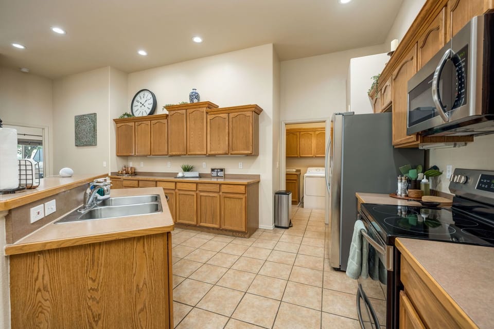 Fully stocked kitchen with stainless steel appliances for all your dine-in needs