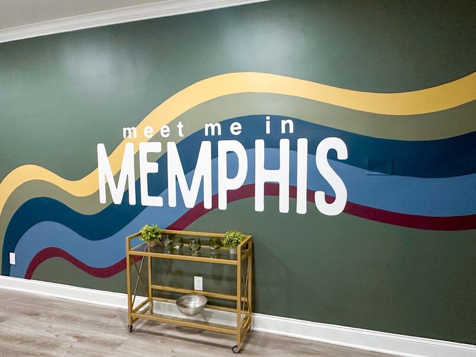 Kitchen and Living Room with a custom designed mural designed by local artist Becka Matthews.