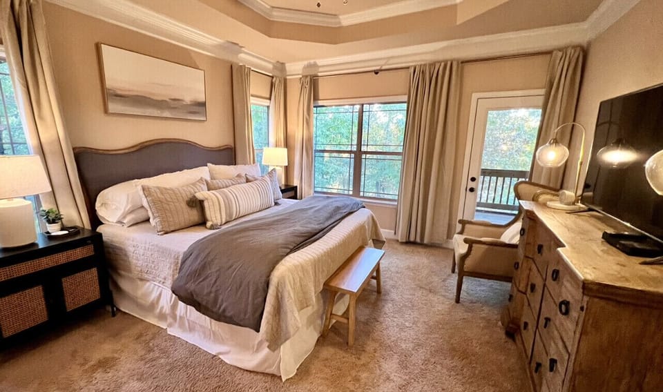 Cozy master bedroom also has a direct view of the lake