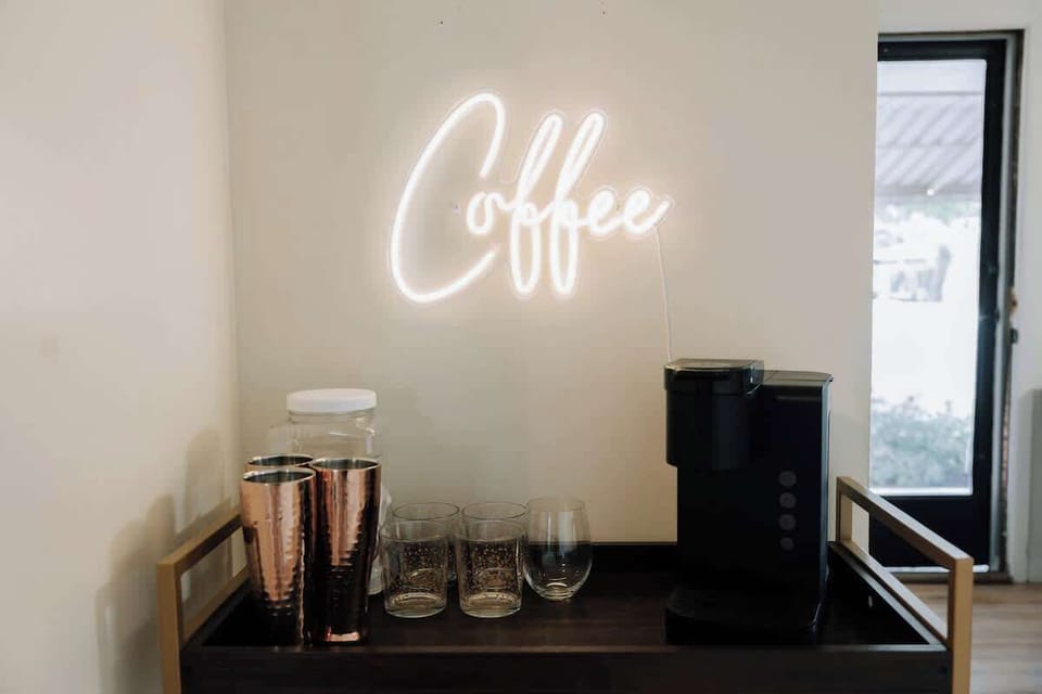 Coffee bar with neon sign — start your mornings right with a fresh cup