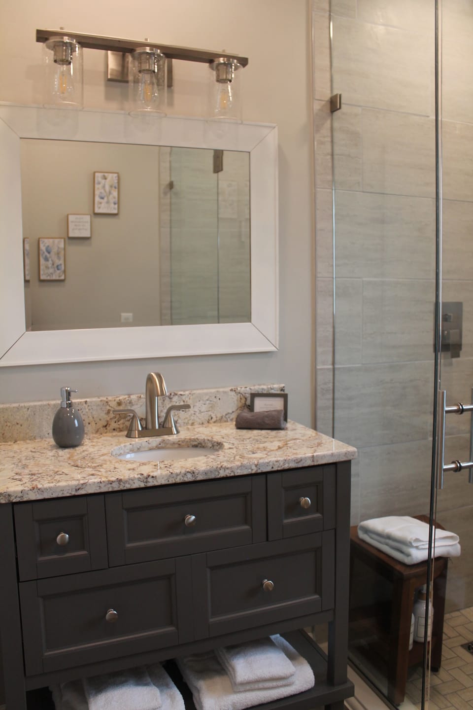 Bathroom with walk in shower, including steam shower and heated floor.
