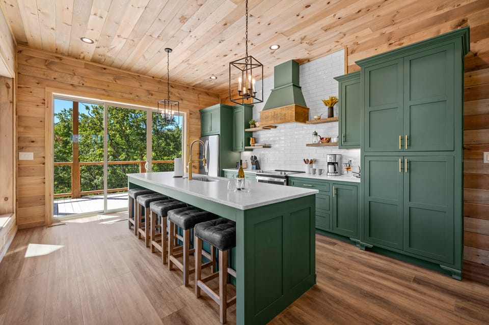 The kitchen is fully stocked with all the plates, utensils, pots, pans, and kitchen equipment you need to prepare a full meal for your family and friends. 