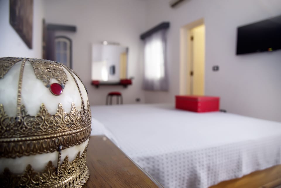 Superior Suite, 1 Bedroom | Minibar, in-room safe, blackout drapes, iron/ironing board