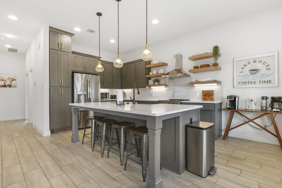 The kitchen bar has bar seating for four.  The dining table is located outside on the deck.