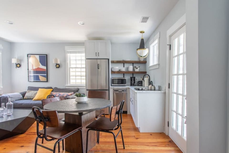 Upstairs Unit Kitchen - Prepare simple meals in our efficient kitchen, featuring a dedicated dining table for four.