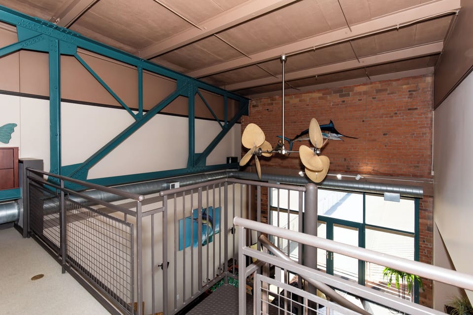 Step into this stunning industrial loft featuring exposed brick walls, soaring ceilings, and unique architectural details that create an unforgettable atmosphere.