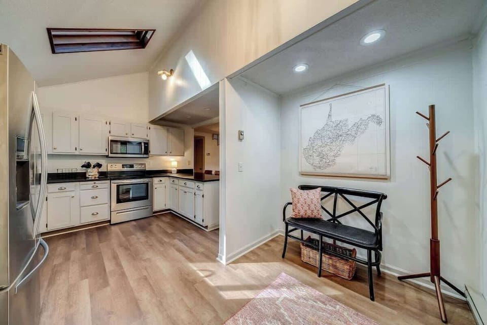 Kitchen and bench near front entrance!  Please note refrigerator was recently replaced and new one does not have an ice maker. Please plan accordingly. Thank you!