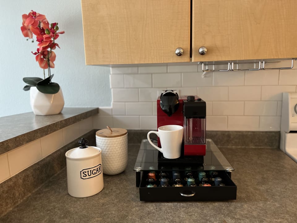 Nespresso machine from Delonghi. Makes great coffee. 
