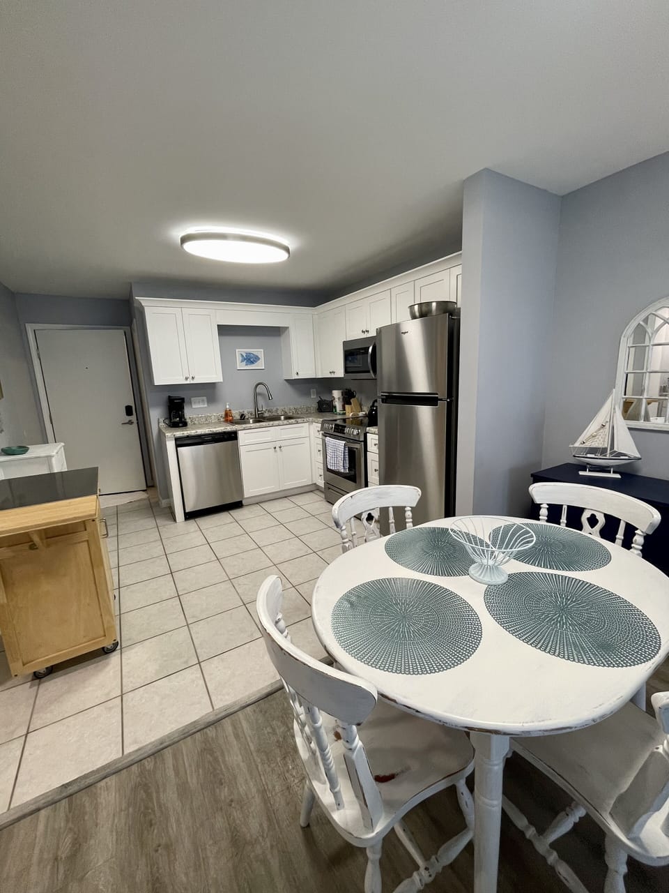 Stainless steel kitchen appliances and island top. 