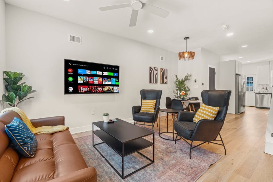 Relax in style with mid-century touches, cozy leather seating, and a smart TV ready for your favorite streaming nights.