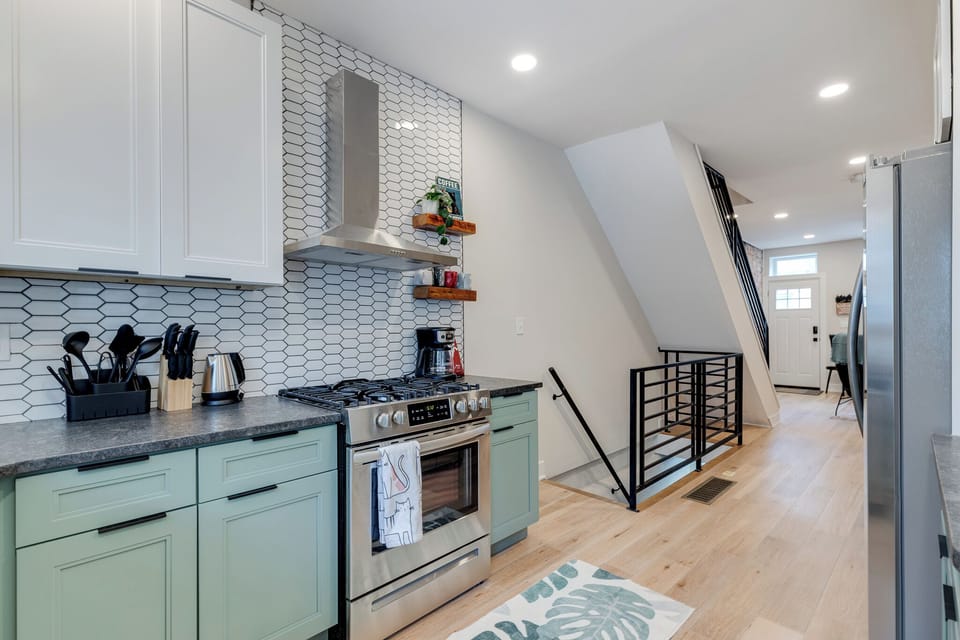 Your kitchen is stocked with essentials and freshly decorated with two tone cabinets and quartz countertops