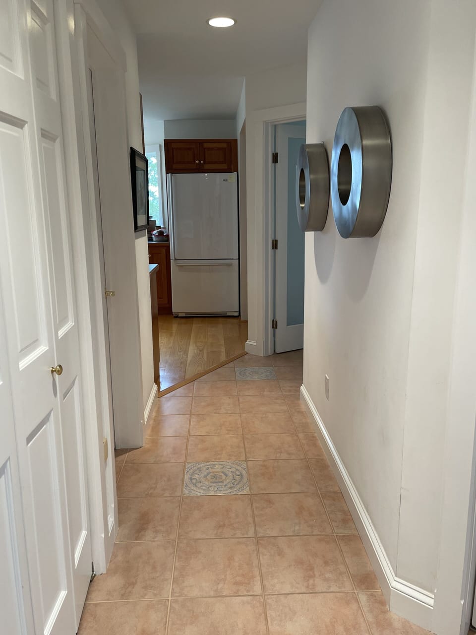 Downstairs hall from foyer to kitchen and laundry