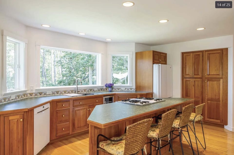 Kitchen: extra seating at bar.  D/W, 4 burner gas range, oven, large fridge