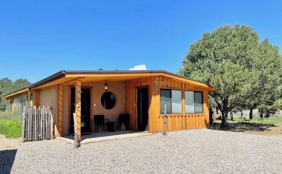 The Ranch House has 3 BRs, a casita, horse boarding, trails, & a wood hot tub.