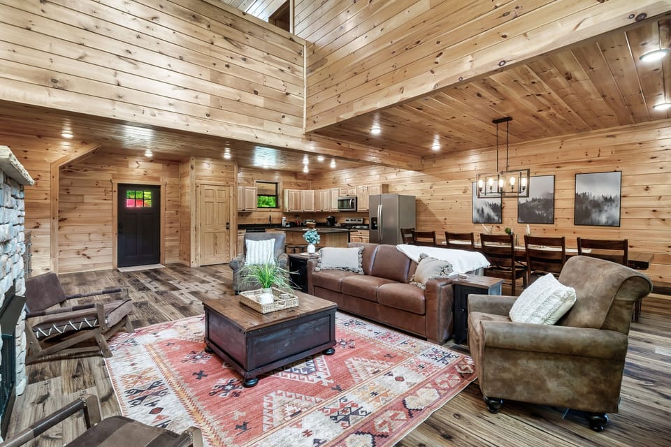 Two story living room open to the dining area.