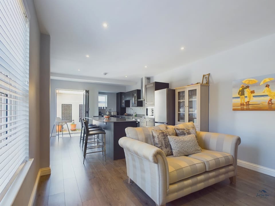 Open plan sitting area with comfortable seating with TV.