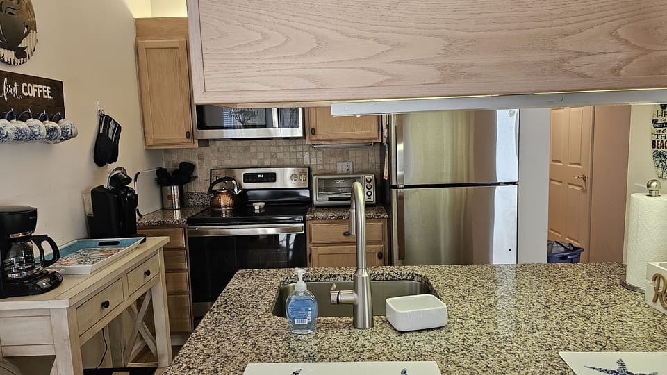 New stainless steel kitchen appliances 2023; 
Granite countertops.