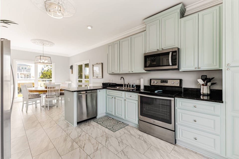 The sink & dishwasher close to the dining area makes cleanup a breeze.