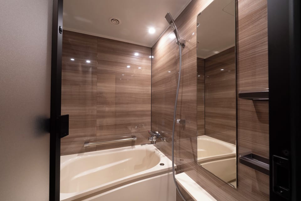 Deluxe Quadruple Room, Multiple Beds, Non Smoking, Bathtub | Bathroom | Shower, hydromassage showerhead, free toiletries, hair dryer