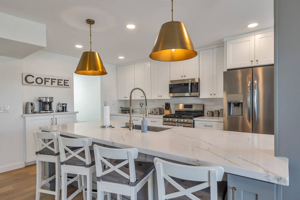Kitchen w/ microwave, stove/oven, fridge, dishwasher, traditional coffee maker, cookware, utensils etc