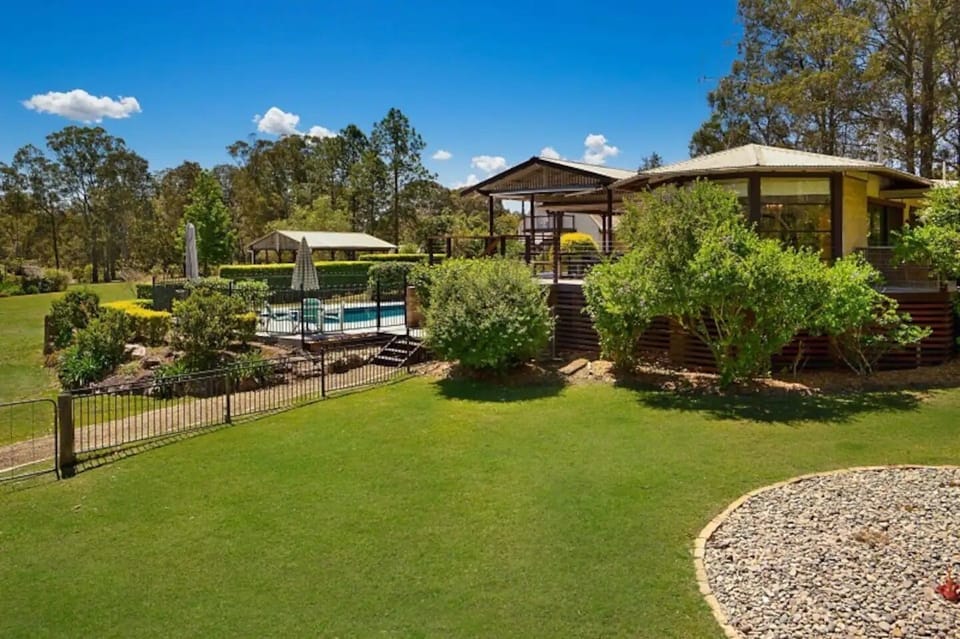View from rear lower lawn to the house and pool