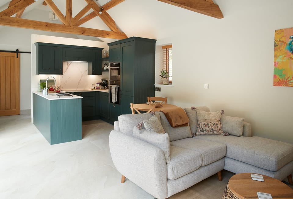 Woodland Retreat, Staffordshire: The open-plan living space with exposed beams