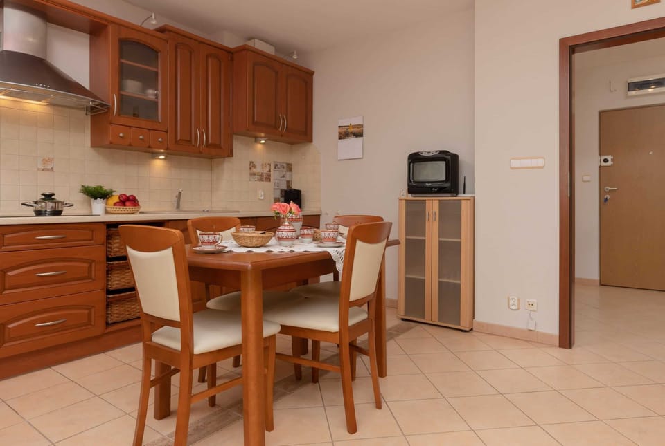 A dining table set with traditional crockery, adding charm and a sense of home to the dining experience.
