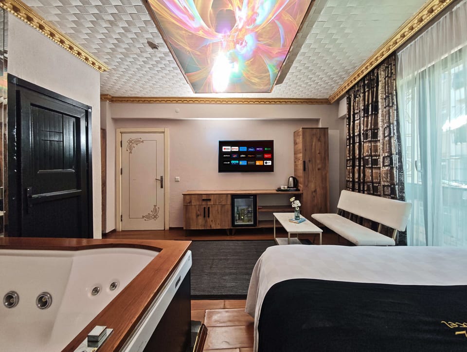 King Room With Jacuzzi | Egyptian cotton sheets, premium bedding, down comforters, minibar